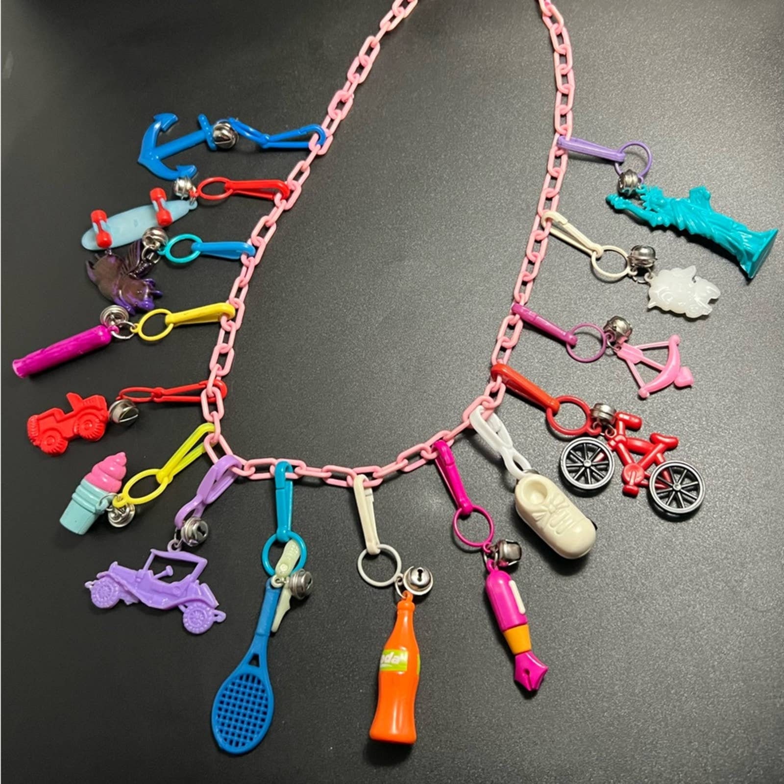 1980's Clip Charms With Bells, Snow Skis, Baby Bottle, Strawberries, Duck  and More on White Plastic Chain Necklace 