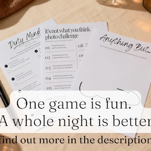 May include: Three white paper game sheets with black text, including "Dirty Mind," "It's Not What You Think Photo Challenge," and "Anything But." A black pen lies on the table. The text overlay reads: "One game is fun. A whole night is better."