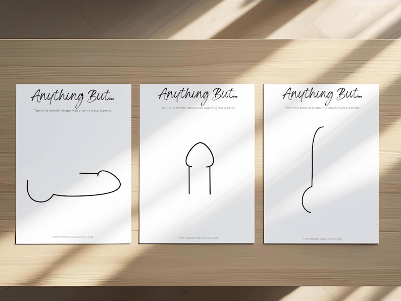 May include: Three white art prints with black line drawings of abstract shapes, each resembling a penis. The prints are arranged on a wooden surface. The text "Anything But..." is at the top of each print.