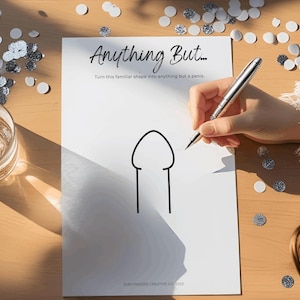 May include: A white sheet of paper with the text "Anything But..." and a simple line drawing of a penis. A person is holding a pen, ready to draw. Confetti and a glass of liquid are on the wooden table.