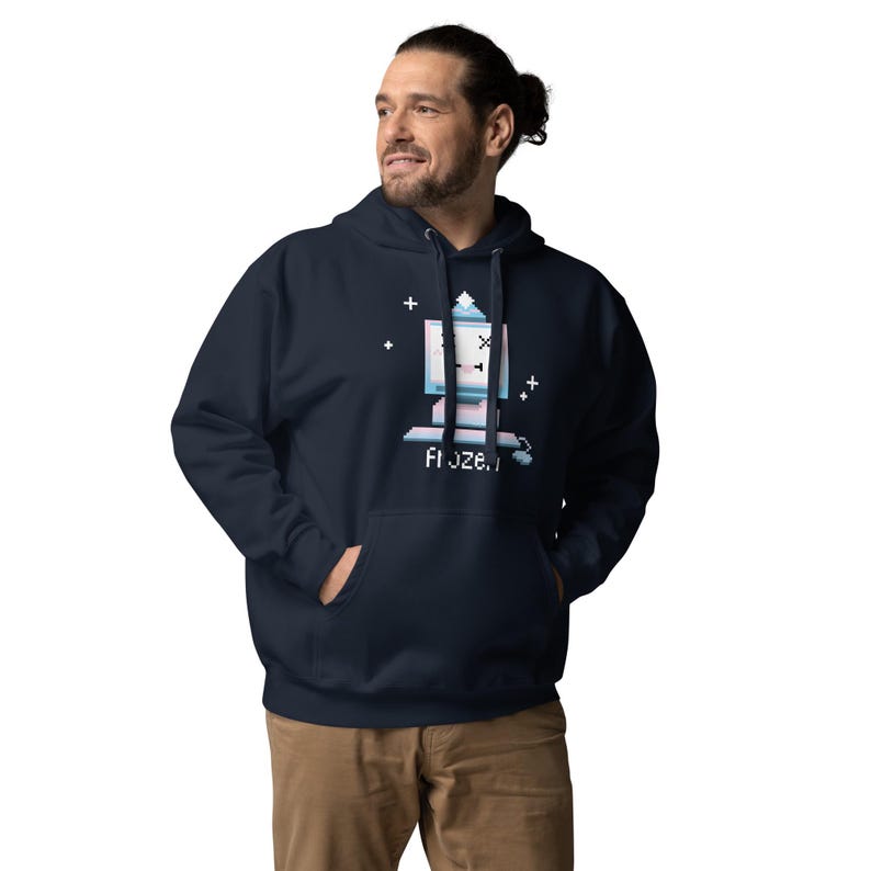frozen computer hoodie cute pixel art retro desktop design funny computer pun old pc with x eyes and tongue out wearing toque pom pom hat snowflakes cozy geek hoodie gamer humor nerd fashion vintage computer art y2k vaporwave aesthetic digital nostalgia funny blue screen parody hoodie cozy kawaii cutecore winter tech lover gift unisex aesthetic clothing alt streetwear retro gamer hoodie cozy winter pullover