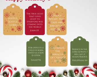 May include: Six printable gift tags with Christmas-themed designs and Bible verses. The tags are rectangular and feature a gold, red, or green background with snowflakes and red stars. The text on the tags includes verses from John 1:9, Isaiah 9:6, Philippians 4:4, and more.