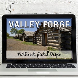 May include: A laptop screen displaying a virtual field trip to Valley Forge. The image shows a row of wooden cabins with a blue sky in the background. The text "Valley Forge Virtual Field Trip" is displayed on the screen.