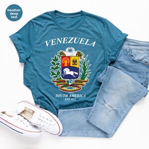 a pair of jeans and a t - shirt on a white background