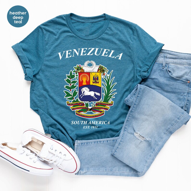 a pair of jeans and a t - shirt on a white background