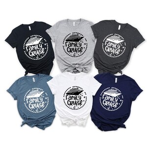 May include: Six t-shirts in different colors with a white graphic of a cruise ship and the text "Family Cruise" in a circle.