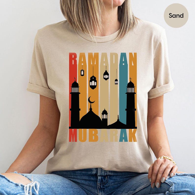 a woman wearing a t - shirt with a picture of a mosque