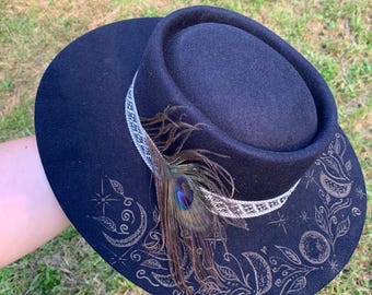 Hand burned moon phases witchy hat with locally sourced peacock feather