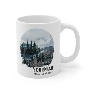May include: White ceramic mug with a watercolor illustration of a forest scene in a circle. The text "YOURNAME" and "Meaning of Name" is printed below the illustration.