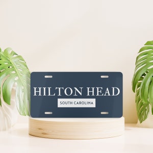 May include: A blue and white license plate with the text "HILTON HEAD" and "SOUTH CAROLINA".