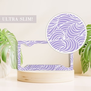 May include: A purple and white license plate frame with a wavy pattern. The text "ULTRA SLIM!" is visible in the top left corner of the image.