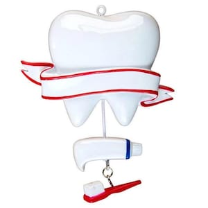 Décoration de Noël dent de dentiste avec du dentifrice et brosse pendantes