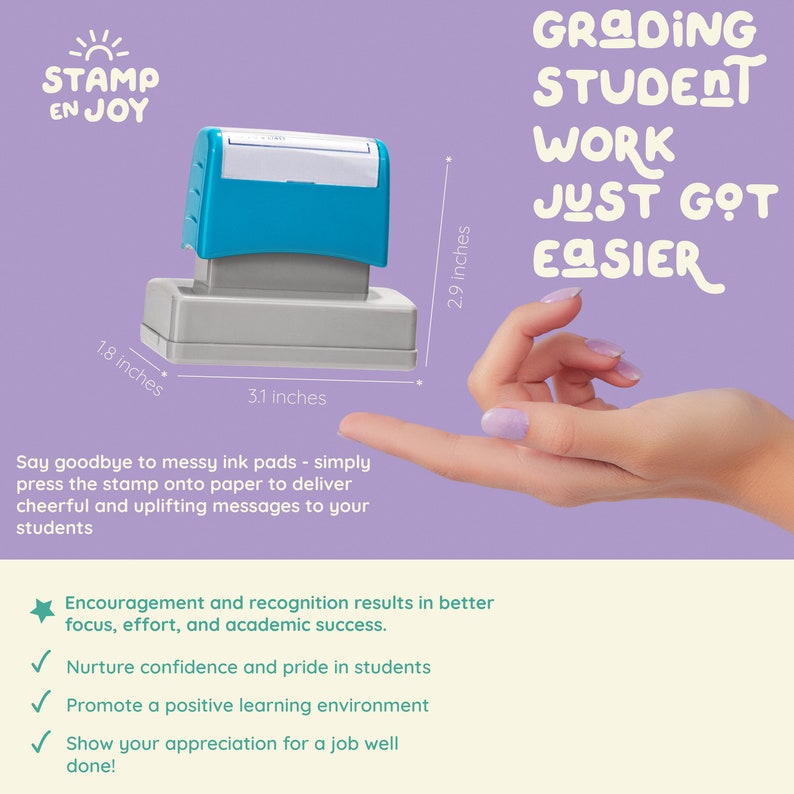 May include: A blue and gray self-inking stamp with the text "STAMP EN JOY" and the phrase "GRADING STUDENT WORK JUST GOT EASIER". The stamp is 3.1 inches wide and 2.9 inches tall.