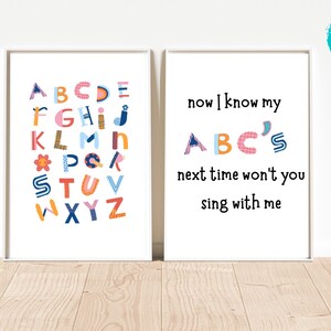May include: Two printable wall art prints with a white background. The left print features a colourful alphabet with each letter decorated with a different pattern. The right print features the text "now I know my ABC's next time won't you sing with me".