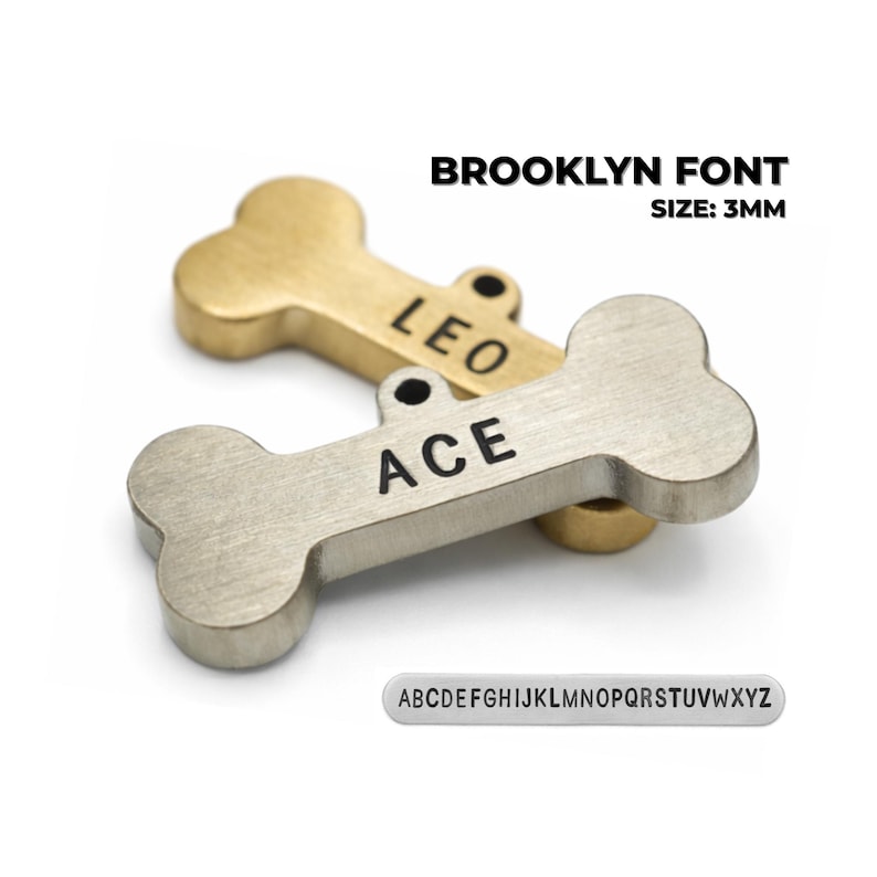 Bone-shaped pet tags in gold and silver tones, personalized with the names "LEO" and "ACE" in black lettering. The tags are made with a Brooklyn font and are 3mm in size. A small alphabet strip is also included. Brooklyn font personalized dog name tag engraved on metal dog tags for pets