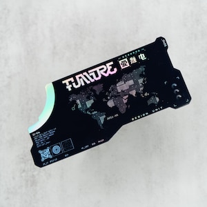 May include: A black, irregularly shaped card featuring a holographic world map graphic, the text "FUTURE" and "DESIGN UNIT," and various technical symbols. The card includes a QR code, small alphanumeric codes, and Chinese characters in white.