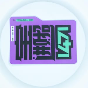 May include: A rectangular purple sticker with rounded corners featuring bold black stylised lettering and a prominent teal graphic element. The sticker includes a white barcode and a green label with the text SN. 139988-AKLL-0887 printed on it.