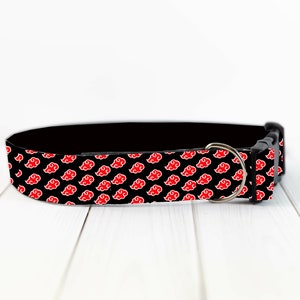 May include: Black dog collar with a red and white cloud pattern.