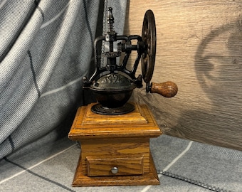 Vintage-Kaffeebohnenmühle aus Holz und schwarzem Gusseisen, einzelnes Mühlrad und Schublade, manuelle Handkurbel-Kaffeebohnenmühle | Alter Retro-Mühlen-Kitchenalia-Mechanismus