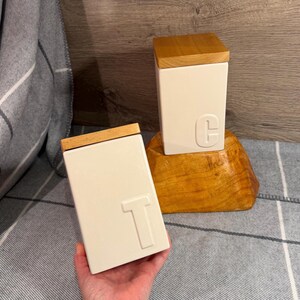 Preloved- Chipped- "T" Tea & "C" Coffee Set of 2 Jars | Wood Lidded Square Cream Beige Colour Daily Kitchenalia Canister and Container Sets