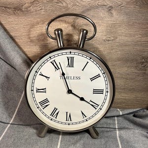 Preloved Giant Round &#39;Timeless&#39; Modern Classic Silver Metal Chrome Footed Table Clock with Roman Numerals and White Dial