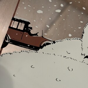 May include: Illustration of a vintage brown car driving through a snowy scene. The car is partially obscured by snowdrifts, with a backdrop of falling snowflakes and a muted color palette.