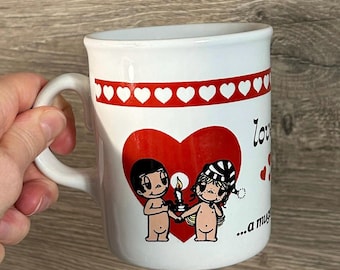 Vintage 1970 &#39;Love Is... a mugs game???!&#39; Kim Casali White Ceramic Mug Cup | Collectible MCM Kitsch Merchandise| Valentine&#39;s Art Kitchenalia
