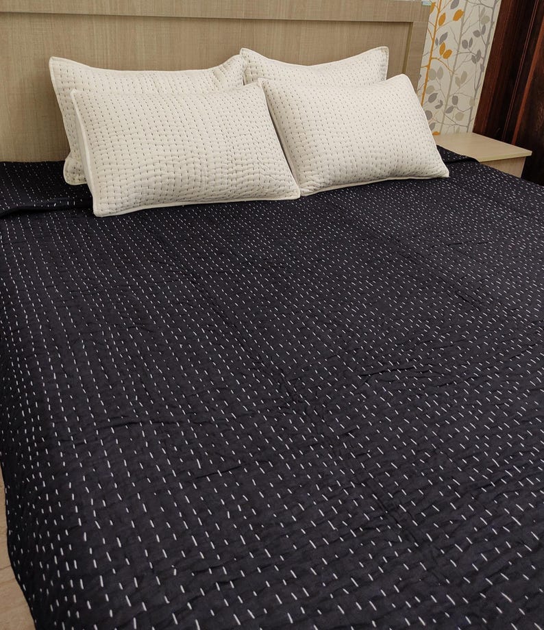 Soft handmade cotton blanket in elegant monochrome style.