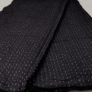 Elegant handcrafted cotton quilt with classic Kantha stitches.