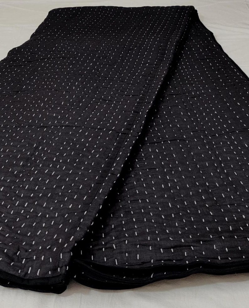 Elegant handcrafted cotton quilt with classic Kantha stitches.
