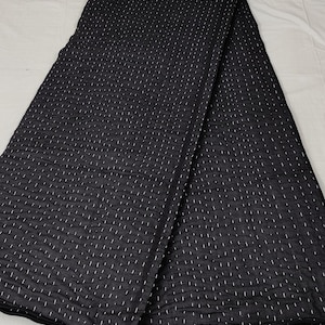 Women Artisan crafted Kantha quilt for modern bedroom décor.