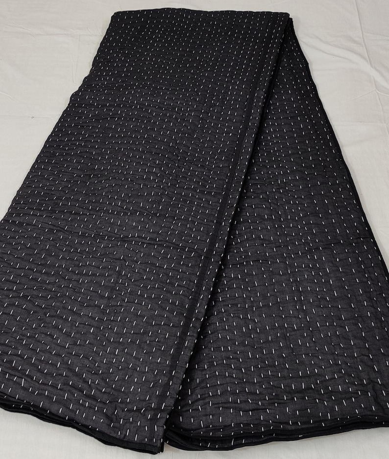Women Artisan crafted Kantha quilt for modern bedroom décor.