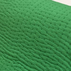 Green boho bedding blanket.