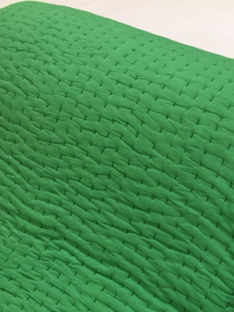 Green boho bedding blanket.