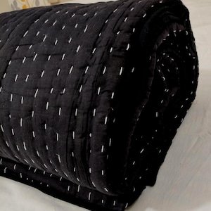 Lightweight handmade throw blanket with timeless styling.