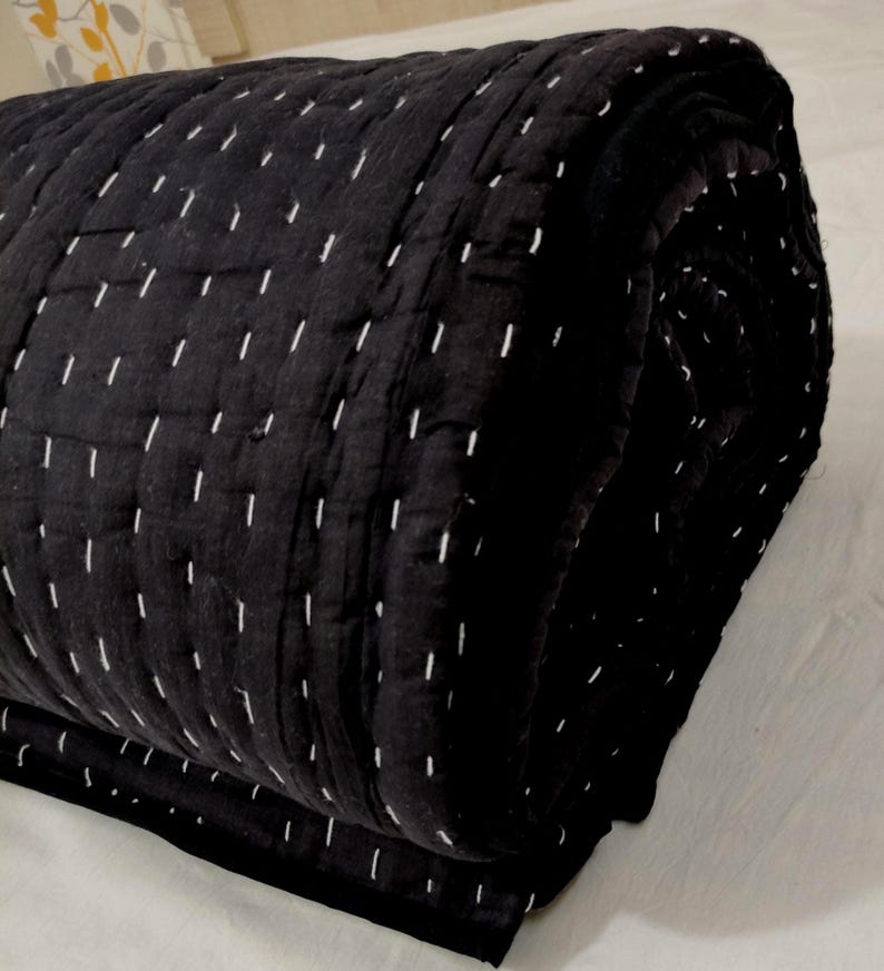 Lightweight handmade throw blanket with timeless styling.
