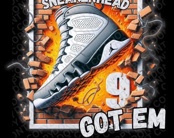 May include: A white and grey sneaker with a red logo breaking through a brick wall with flames. The text "SNEAKERHEAD GOT EM" is printed below the sneaker.