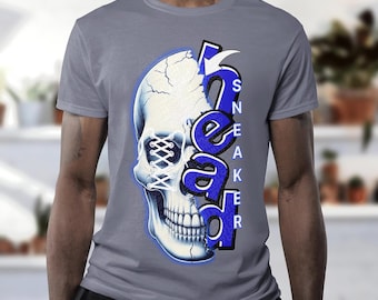 May include: A gray t-shirt with a blue and white graphic of a skull with a sneaker design. The text "SNEAKER HEAD" is printed vertically on the skull.