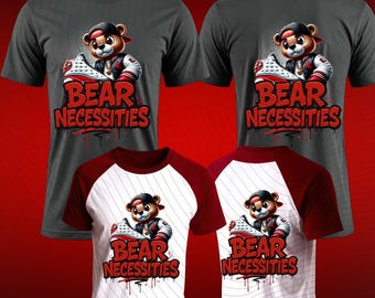 May include: Four t-shirts with a graphic of a bear wearing a cap and holding a sneaker. The text "BEAR NECESSITIES" is in red with a graffiti-style drip effect. Two shirts are gray, and two are white with red sleeves.