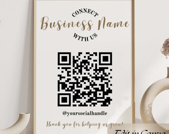 May include: A white poster with a gold frame, featuring a black and white QR code. The text "CONNECT" is above the QR code, followed by "Business Name" in a larger font. Below the QR code is the text "@yoursocialhandle" and "Thank you for helping us grow!" The poster also includes the text "Edit in Canva" in the bottom right corner.