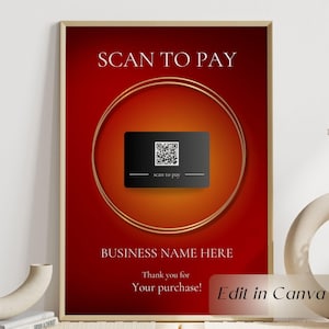May include: A framed poster with a red and orange gradient background. The text "SCAN TO PAY" is at the top, with a QR code and "scan to pay" text below. The words "BUSINESS NAME HERE" and "Thank you for Your purchase!" are also visible.