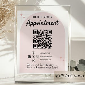 Op de afbeelding: Een helder acrylbord met de tekst "BOOK YOUR Appointment" in zwart schrift. Een QR-code is gecentreerd onder de tekst, met contactgegevens en de zin "Quick and Easy Booking - Scan to Reserve Your Spot!"