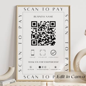 May include: A framed print with a beige background and black text that says "Scan to Pay." It features a QR code, icons, and contact information. The words "Thank you for your purchase!" are also included.