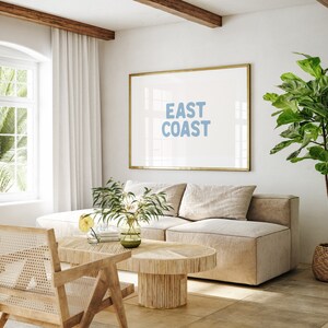 Minimalist typography wall art featuring the words “East Coast” in soft blue lettering on a clean off-white background. A modern, coastal-inspired print perfect for beach house decor, summer homes, living rooms, bedrooms or relaxed contemporary spaces. The simple design and airy colour palette create an effortless, laid-back seaside feel. This listing is for a digital download only. No physical print or frame included.