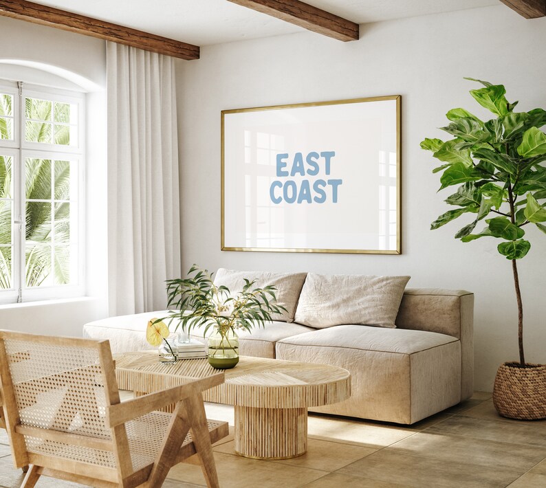 Minimalist typography wall art featuring the words “East Coast” in soft blue lettering on a clean off-white background. A modern, coastal-inspired print perfect for beach house decor, summer homes, living rooms, bedrooms or relaxed contemporary spaces. The simple design and airy colour palette create an effortless, laid-back seaside feel. This listing is for a digital download only. No physical print or frame included.