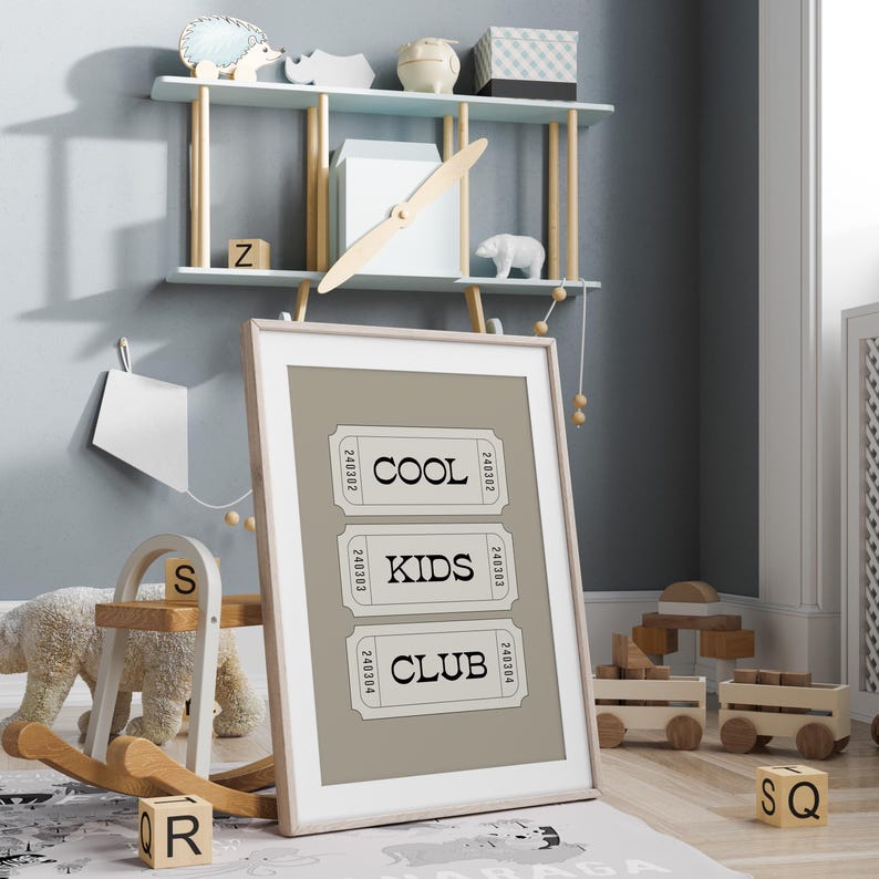Typography wall art featuring three stacked ticket style designs with the words “Cool Kids Club” in bold black lettering on a neutral taupe background. Minimalist modern graphic print with a playful, retro inspired feel. This listing is for a digital download only. No physical print or frame included.