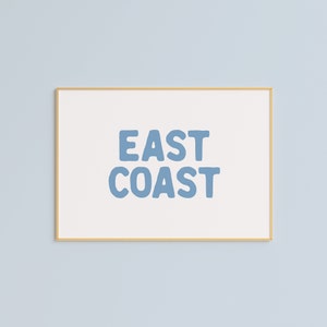 Minimalist typography wall art featuring the words “East Coast” in soft blue lettering on a clean off-white background. A modern, coastal-inspired print perfect for beach house decor, summer homes, living rooms, bedrooms or relaxed contemporary spaces. The simple design and airy colour palette create an effortless, laid-back seaside feel. This listing is for a digital download only. No physical print or frame included.