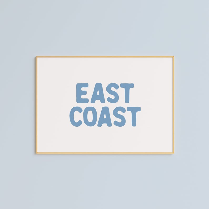 Minimalist typography wall art featuring the words “East Coast” in soft blue lettering on a clean off-white background. A modern, coastal-inspired print perfect for beach house decor, summer homes, living rooms, bedrooms or relaxed contemporary spaces. The simple design and airy colour palette create an effortless, laid-back seaside feel. This listing is for a digital download only. No physical print or frame included.
