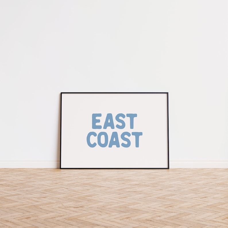 Minimalist typography wall art featuring the words “East Coast” in soft blue lettering on a clean off-white background. A modern, coastal-inspired print perfect for beach house decor, summer homes, living rooms, bedrooms or relaxed contemporary spaces. The simple design and airy colour palette create an effortless, laid-back seaside feel. This listing is for a digital download only. No physical print or frame included.