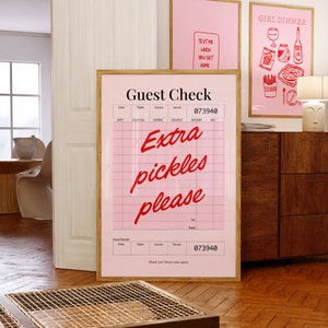 May include: A pink and white guest check with the text "Extra pickles please" in red. The check has a header that says "Guest Check" and a number "073940".